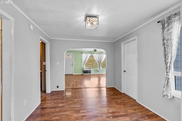 880 Heppner Spray Hwy, Heppner, OR 97836 - empty room featuring crown molding, arched walkways, and wood finished floors