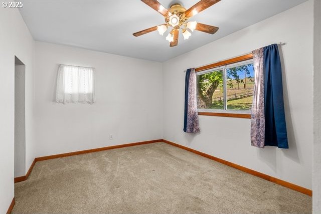 880 Heppner Spray Hwy, Heppner, OR 97836 - carpeted spare room featuring healthy amount of natural light, baseboards, and ceiling fan