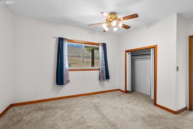 880 Heppner Spray Hwy, Heppner, OR 97836 - unfurnished bedroom with carpet floors, baseboards, a closet, and a ceiling fan
