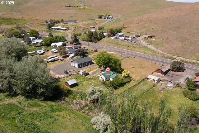 880 Heppner Spray Hwy, Heppner, OR 97836 - aerial view of property and surrounding area featuring rural landscape