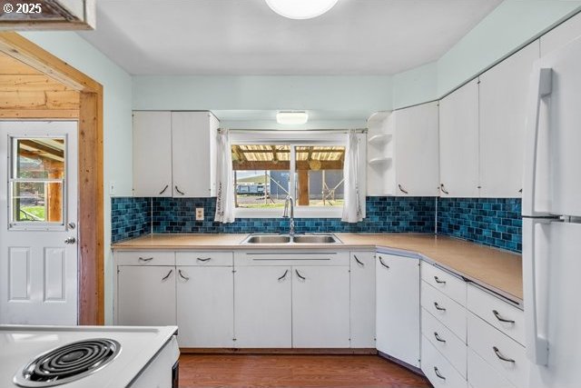 880 Heppner Spray Hwy, Heppner, OR 97836 - kitchen featuring a sink, freestanding refrigerator, light countertops, and decorative backsplash