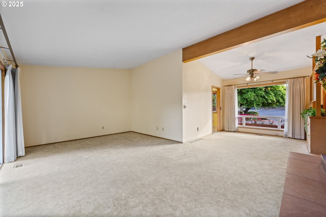 unfurnished living room featuring a ceiling fan and carpet floors