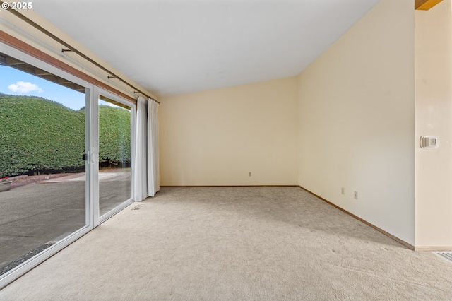 unfurnished room featuring carpet flooring and baseboards