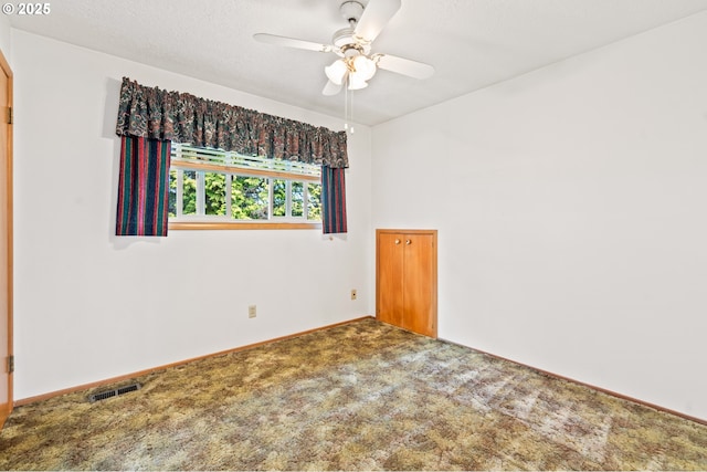 unfurnished room with ceiling fan, carpet flooring, and baseboards