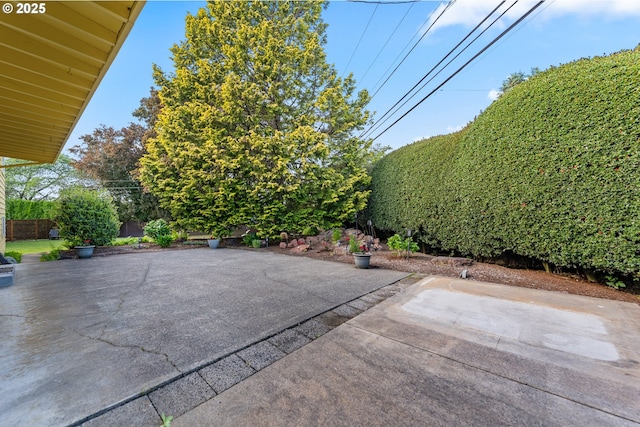 view of patio featuring fence