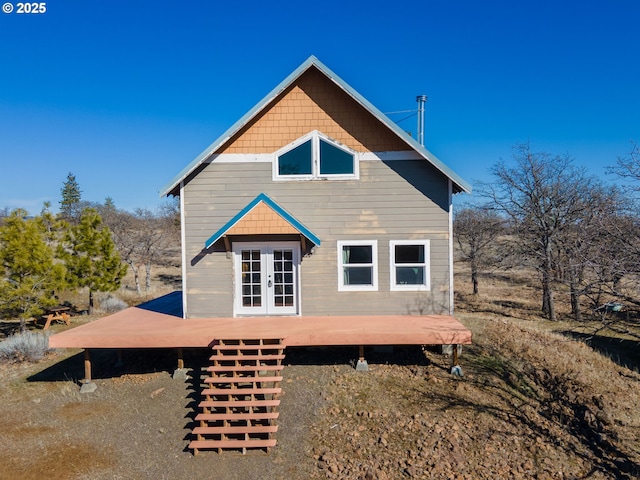 back of property featuring french doors and a deck