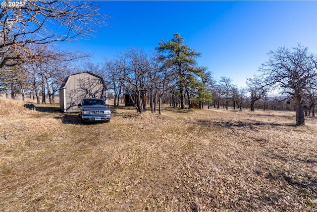 view of yard featuring an outbuilding and a barn