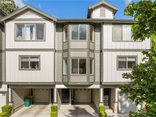 10450 SW Akilean Ter Unit 45, Portland, OR 97223 - view of front of house featuring an attached garage, driveway, and board and batten siding