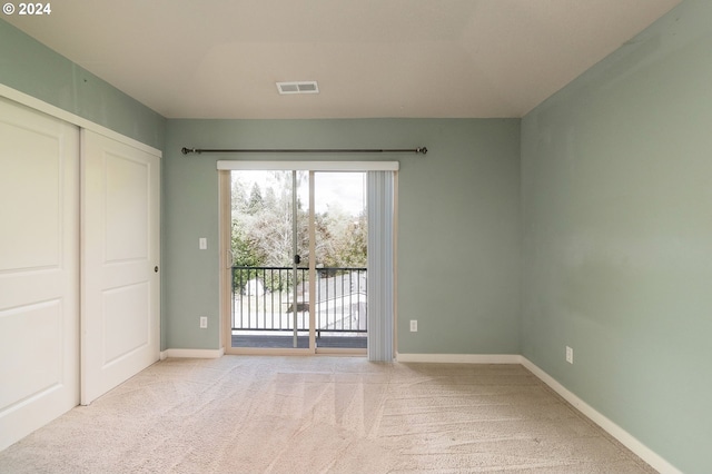 10450 SW Akilean Ter Unit 45, Portland, OR 97223 - unfurnished bedroom with access to outside, light carpet, a closet, and baseboards