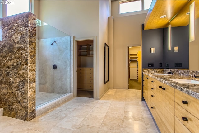 17907 SW Cicero Ct, Beaverton, OR 97007 - full bathroom with walk in shower, vanity, a towering ceiling, and a spacious closet