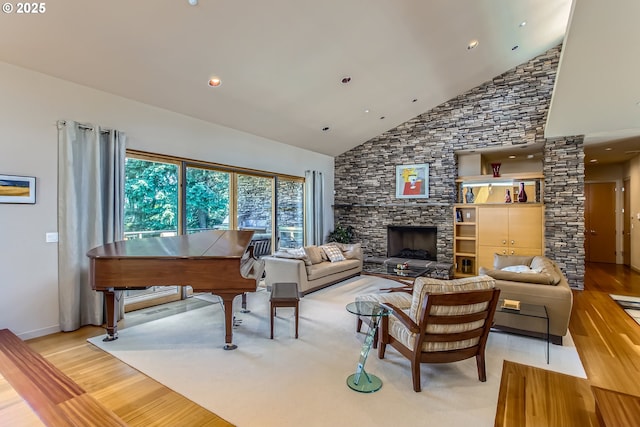 17907 SW Cicero Ct, Beaverton, OR 97007 - living room with light wood finished floors, high vaulted ceiling, and a stone fireplace
