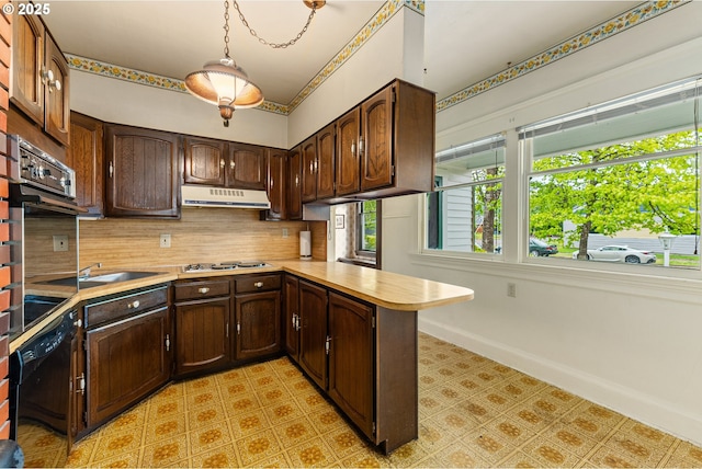 406 8th St, Springfield, OR 97477 - kitchen with light countertops, decorative backsplash, dishwasher, a peninsula, and under cabinet range hood