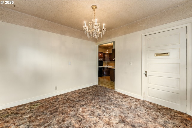 406 8th St, Springfield, OR 97477 - empty room featuring a chandelier, carpet floors, baseboards, and a textured ceiling