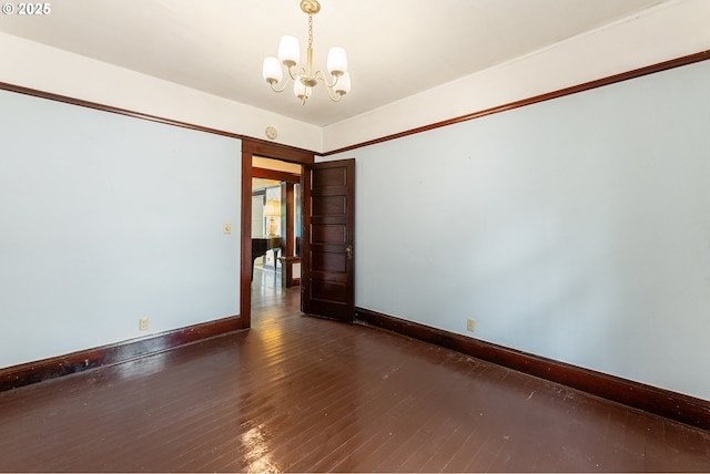 406 8th St, Springfield, OR 97477 - empty room featuring a chandelier, wood-type flooring, and baseboards