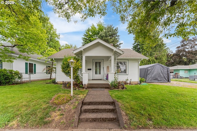 406 8th St, Springfield, OR 97477 - bungalow-style home with a porch and roof with shingles
