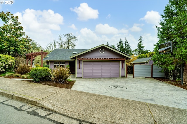 ranch-style home featuring a pergola, a garage, driveway, and roof with shingles