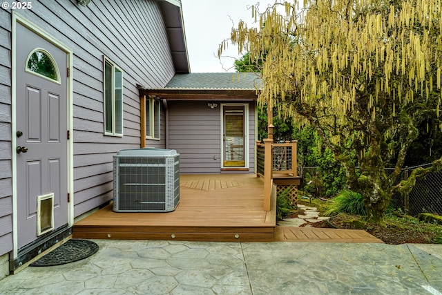 deck with cooling unit and a patio