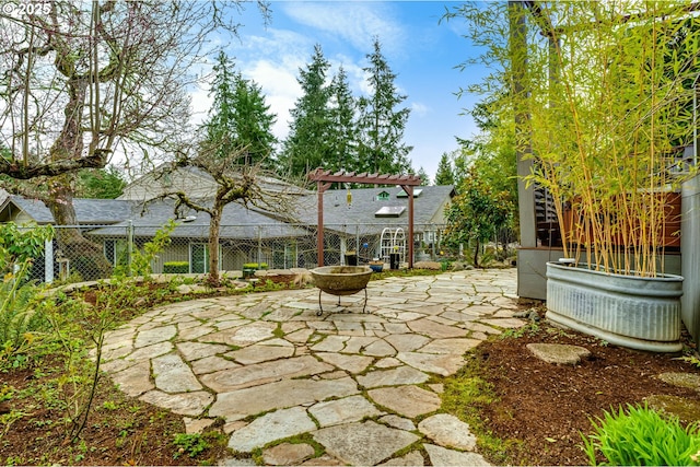 view of patio / terrace featuring fence and a pergola