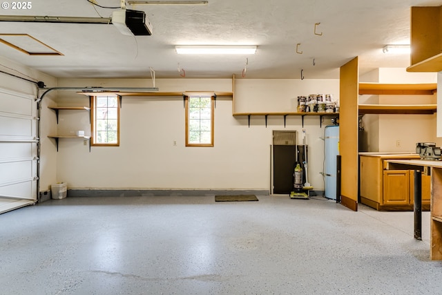 garage with water heater and a garage door opener