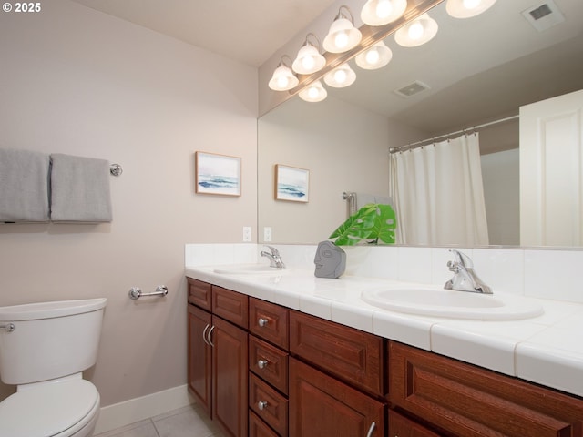 15320 SW Jasper Ln, Beaverton, OR 97007 - full bathroom with toilet, double vanity, tile patterned floors, baseboards, and a shower with shower curtain