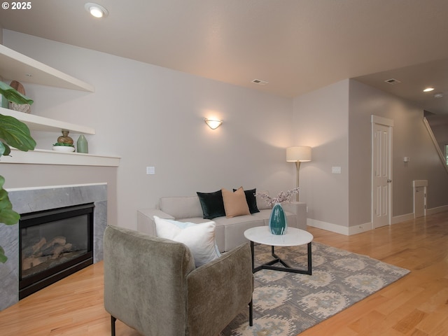 15320 SW Jasper Ln, Beaverton, OR 97007 - living area with wood finished floors, a fireplace, baseboards, and recessed lighting