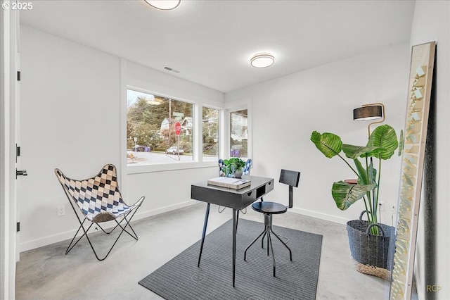 office with concrete flooring