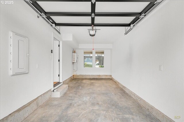 garage with electric panel and a garage door opener