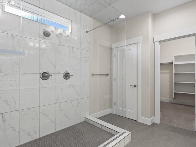 bathroom with a tile shower