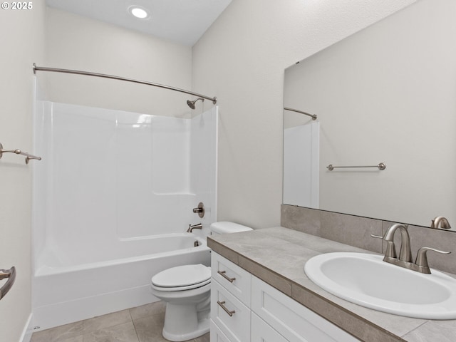 full bathroom with tile patterned flooring, vanity, bathtub / shower combination, and toilet