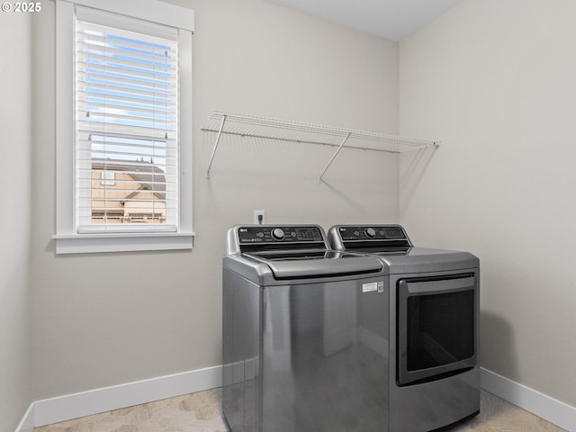 laundry room featuring washer and clothes dryer