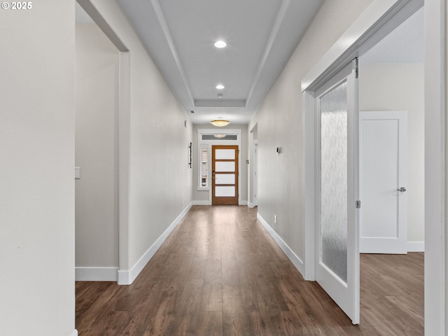 corridor with dark wood-type flooring