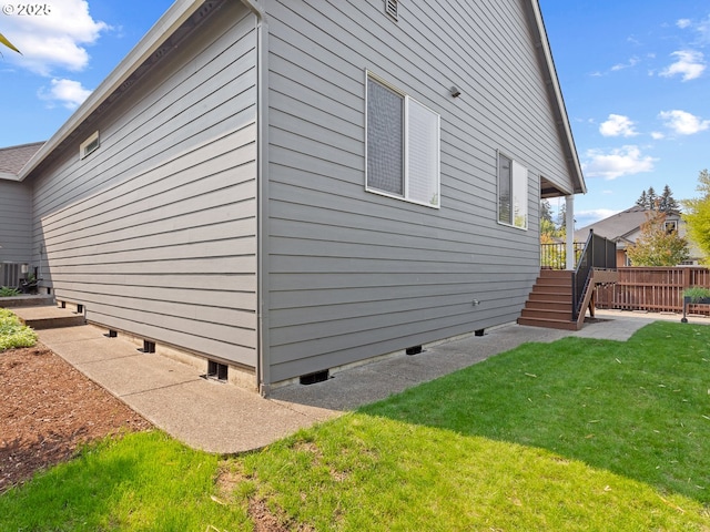 view of side of property with a yard