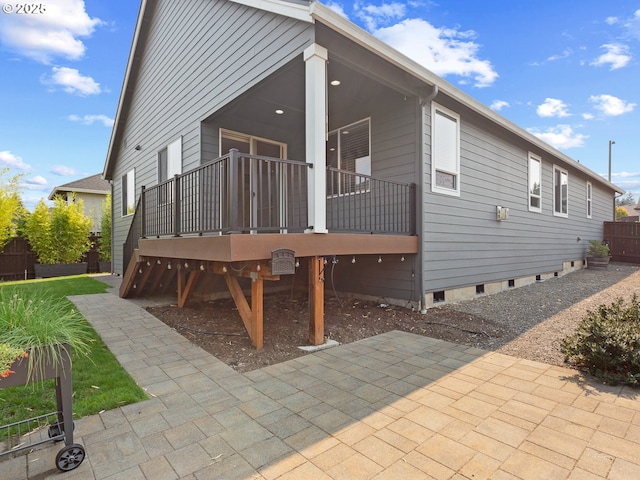 rear view of property featuring a patio area