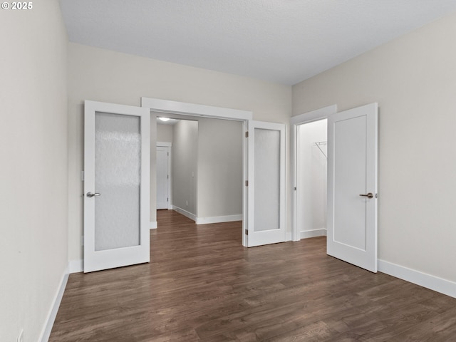 unfurnished bedroom featuring dark hardwood / wood-style floors