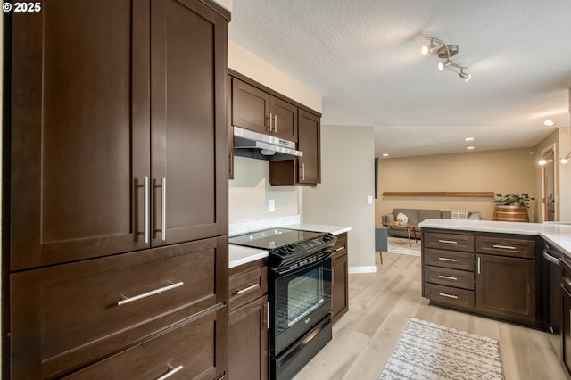 kitchen featuring black / electric stove, under cabinet range hood, dark brown cabinets, light countertops, and a textured ceiling