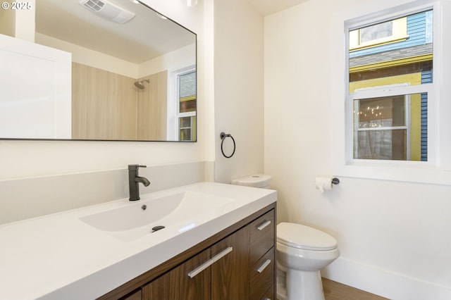 bathroom with vanity and toilet