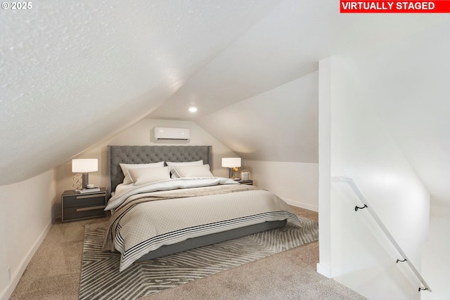 bedroom featuring light colored carpet, a wall mounted air conditioner, and lofted ceiling