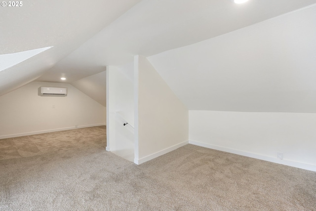 bonus room with light colored carpet, vaulted ceiling with skylight, and a wall mounted AC