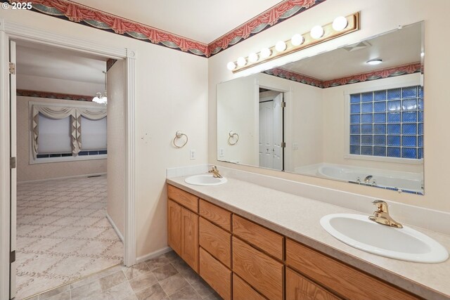 full bathroom featuring double vanity and a garden tub