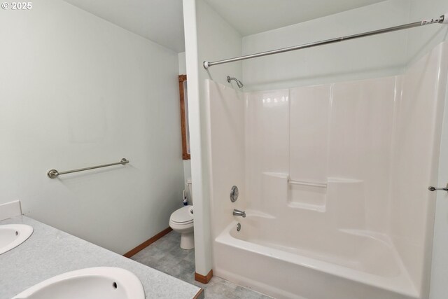 full bathroom with toilet, shower / washtub combination, vanity, and baseboards