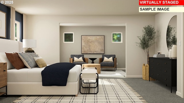 bedroom featuring light colored carpet and baseboards