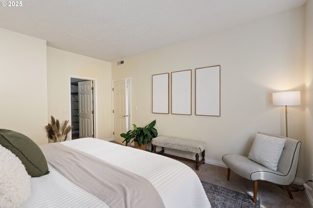 bedroom featuring carpet floors and baseboards