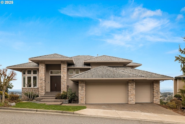 prairie-style home featuring a garage