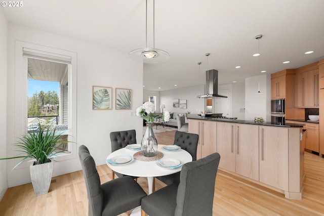 dining room with light wood-type flooring