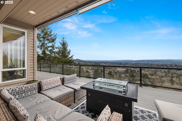 wooden deck featuring grilling area and an outdoor living space