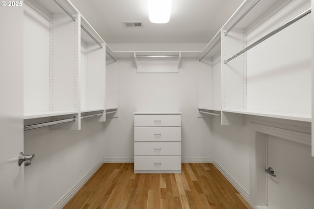 walk in closet featuring light hardwood / wood-style floors