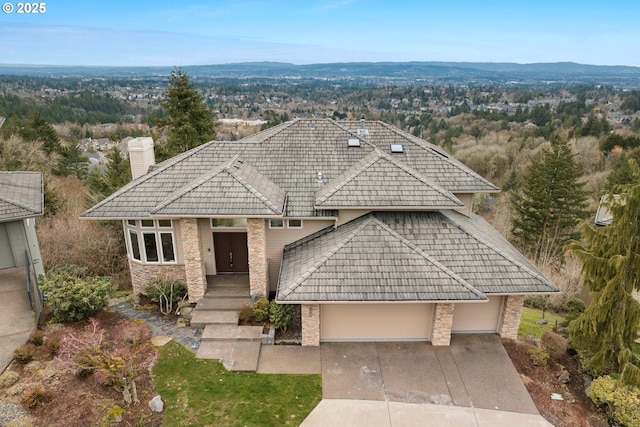 view of front of home featuring a garage and a mountain view