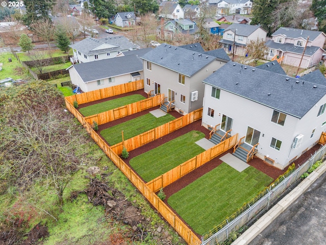 birds eye view of property with a residential view