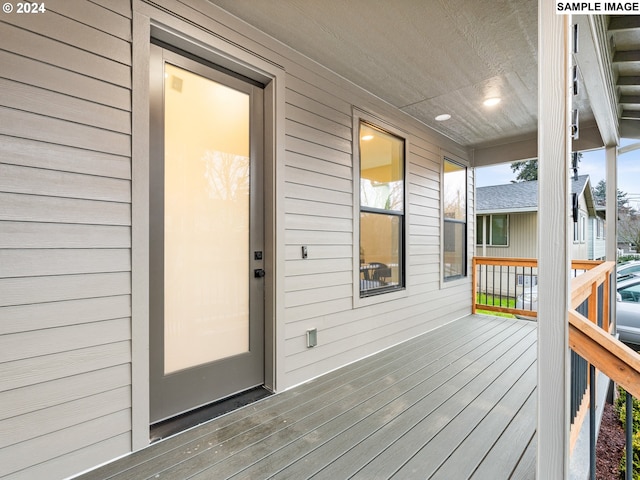 wooden terrace featuring a porch