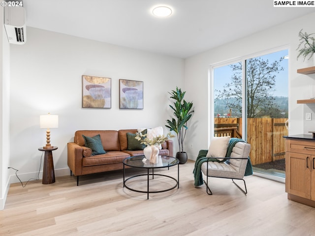 living room with baseboards and light wood-type flooring
